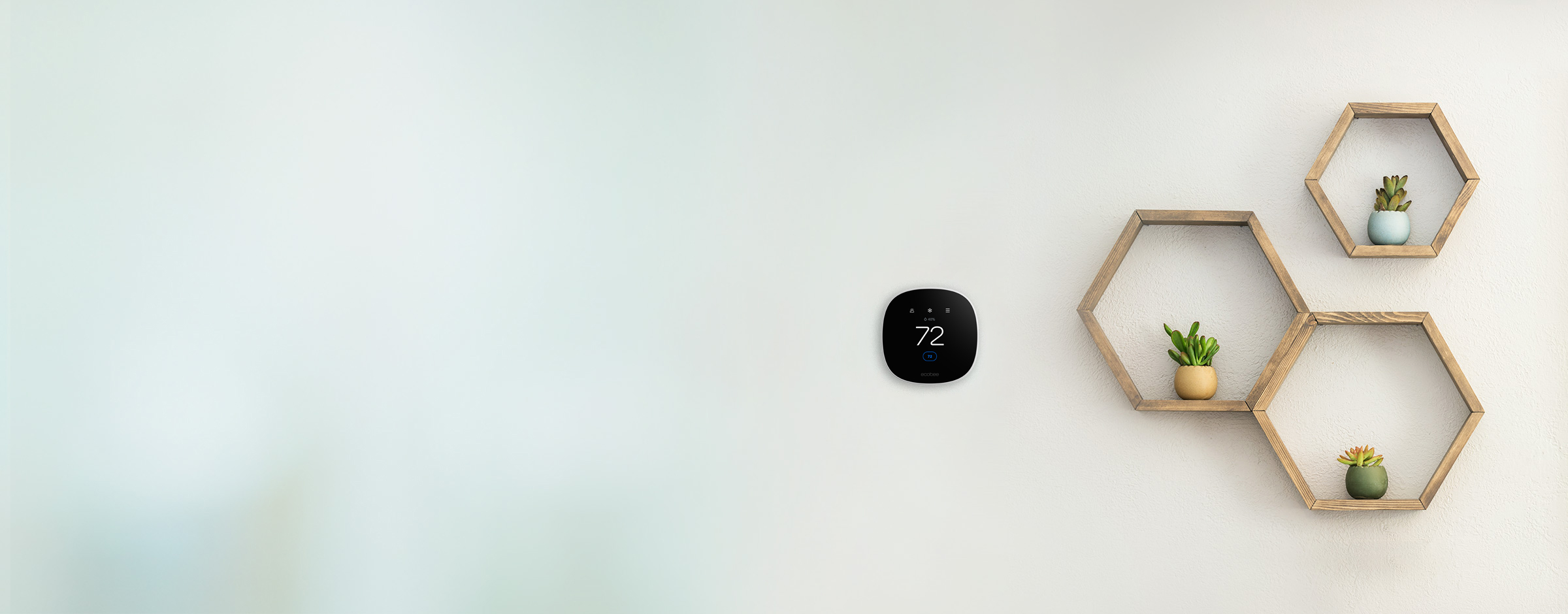 ecobee thermostat on wall with decorative frames